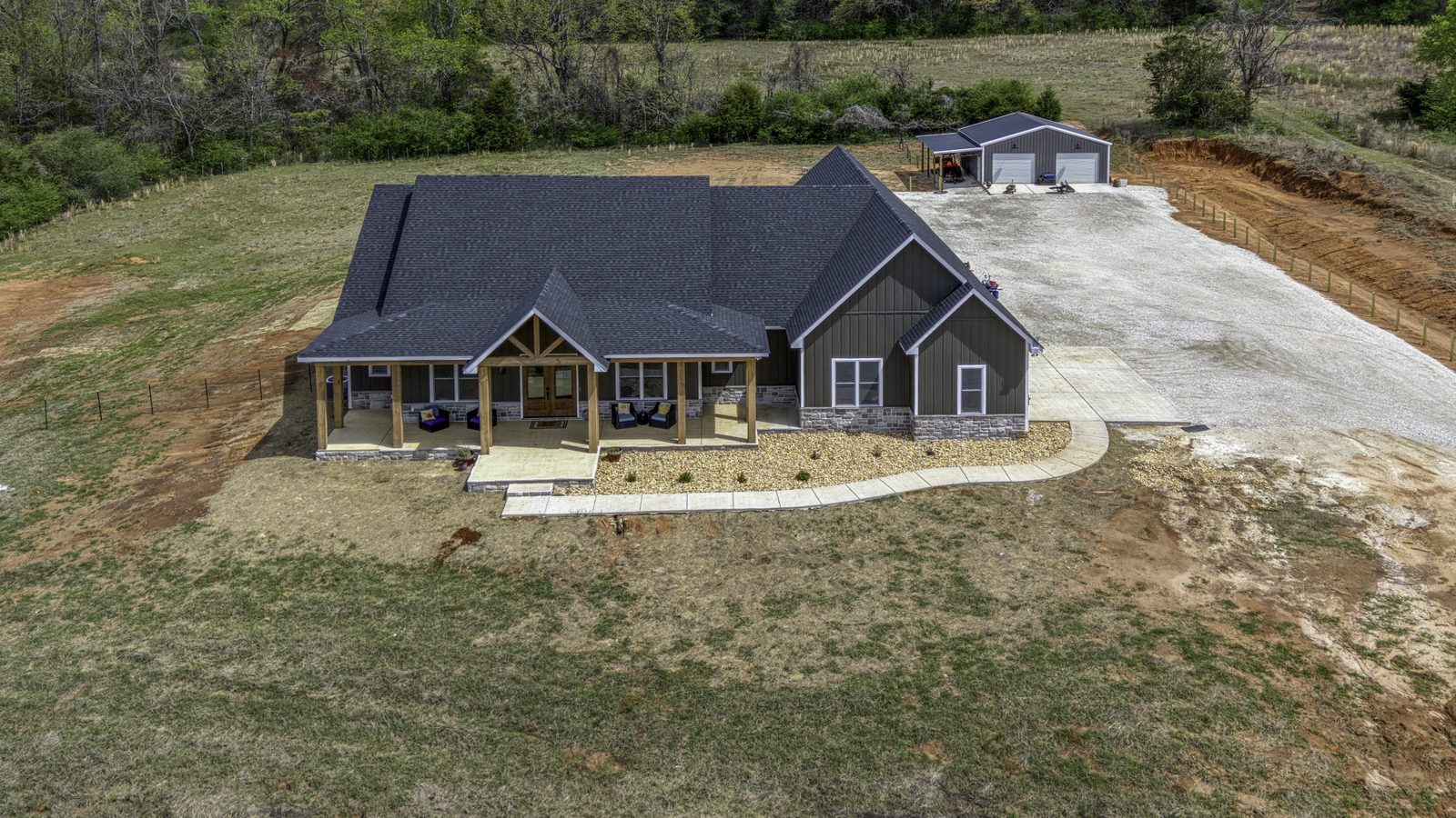 The Stone Craftsman overhead aerial of the home and property