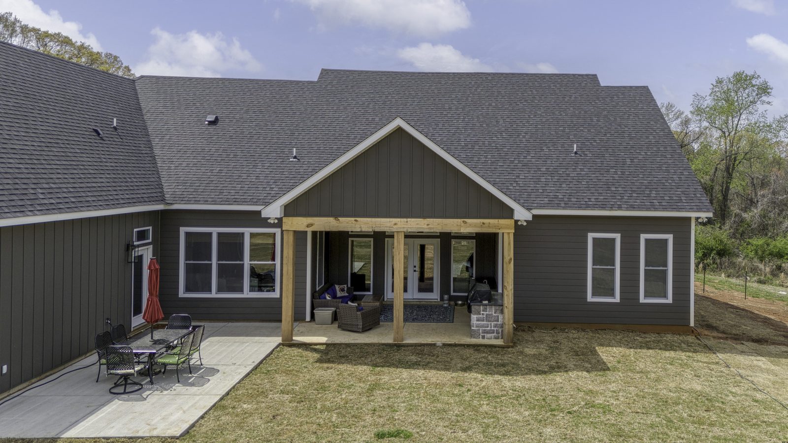 The Stone Craftsman covered back porch and patio