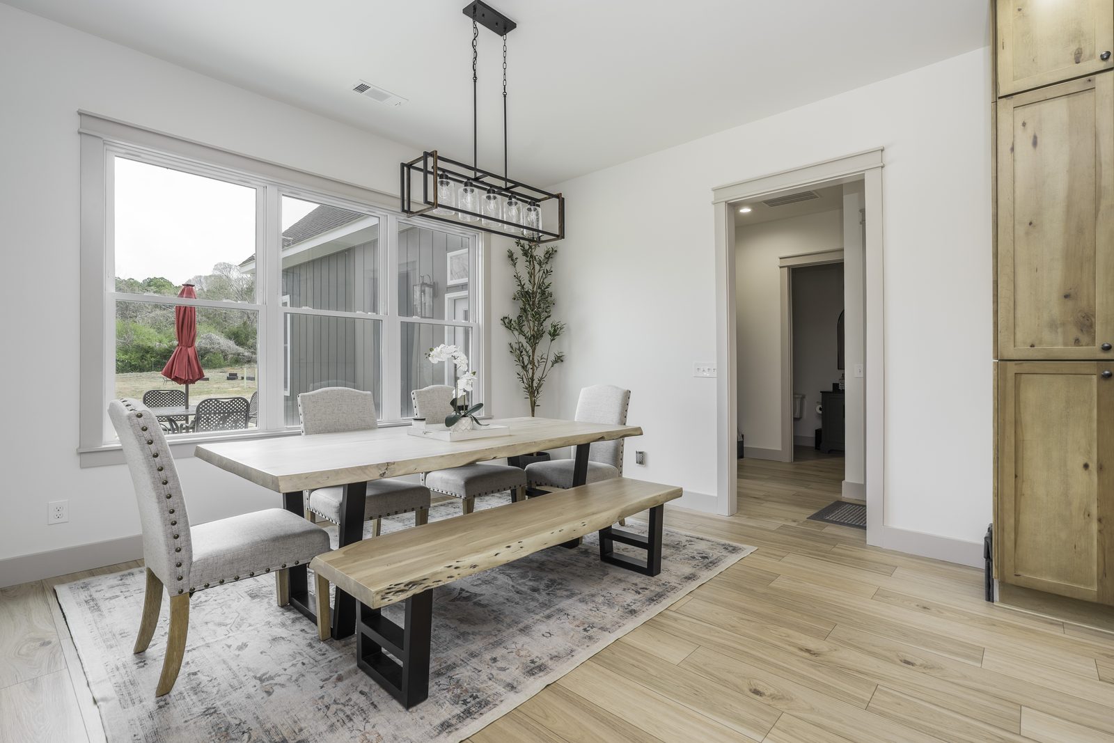 The Stone Craftsman dining area with farmhouse table and bench