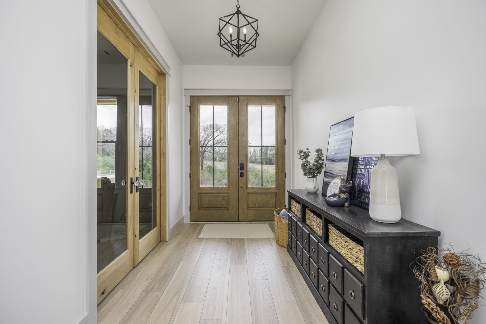 The Stone Craftsman entry hall with double glass front doors