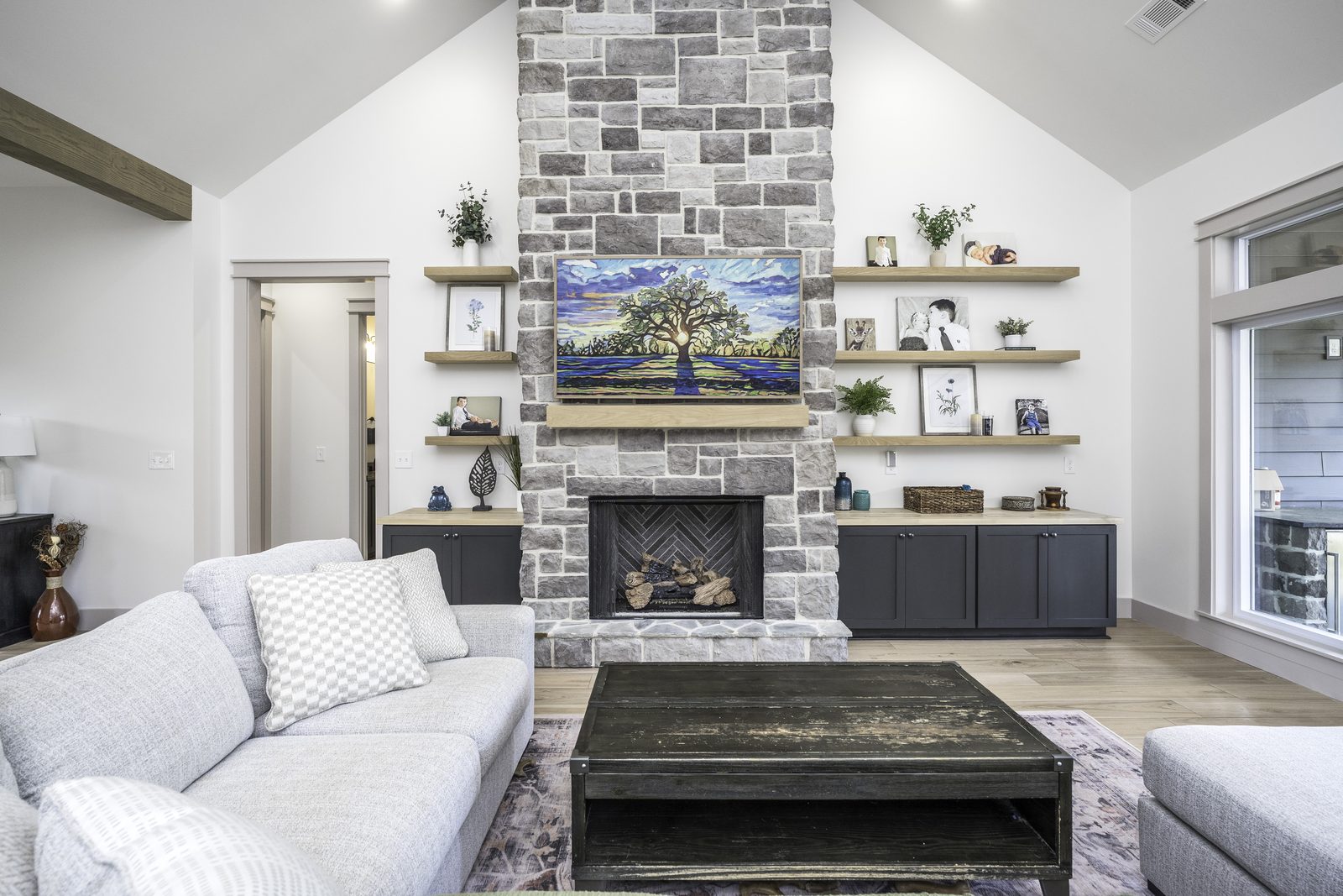 The Stone Craftsman living room view toward the stone fireplace