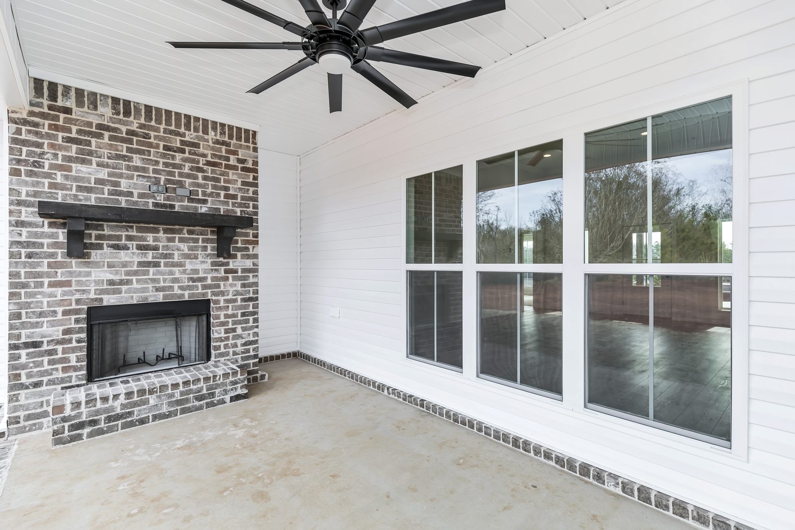 The Modern Farmhouse covered porch fireplace