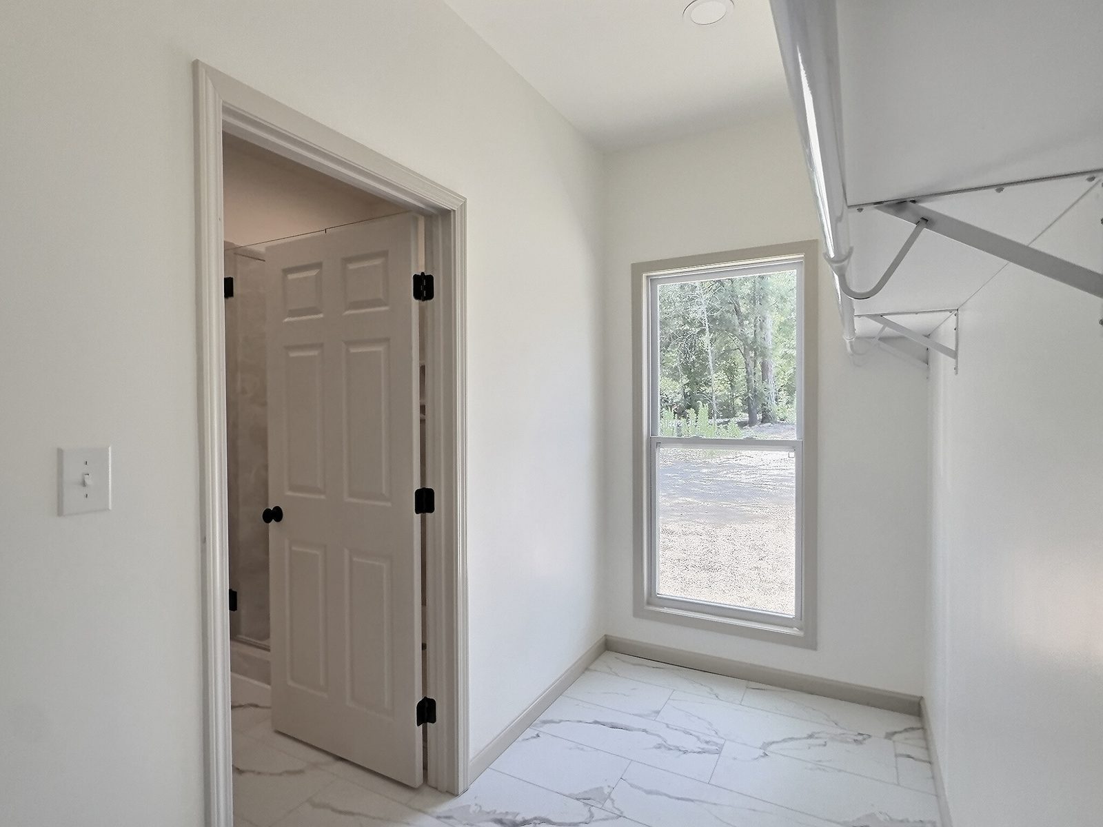 The Cedar Ranch primary walk-in closet with shelving