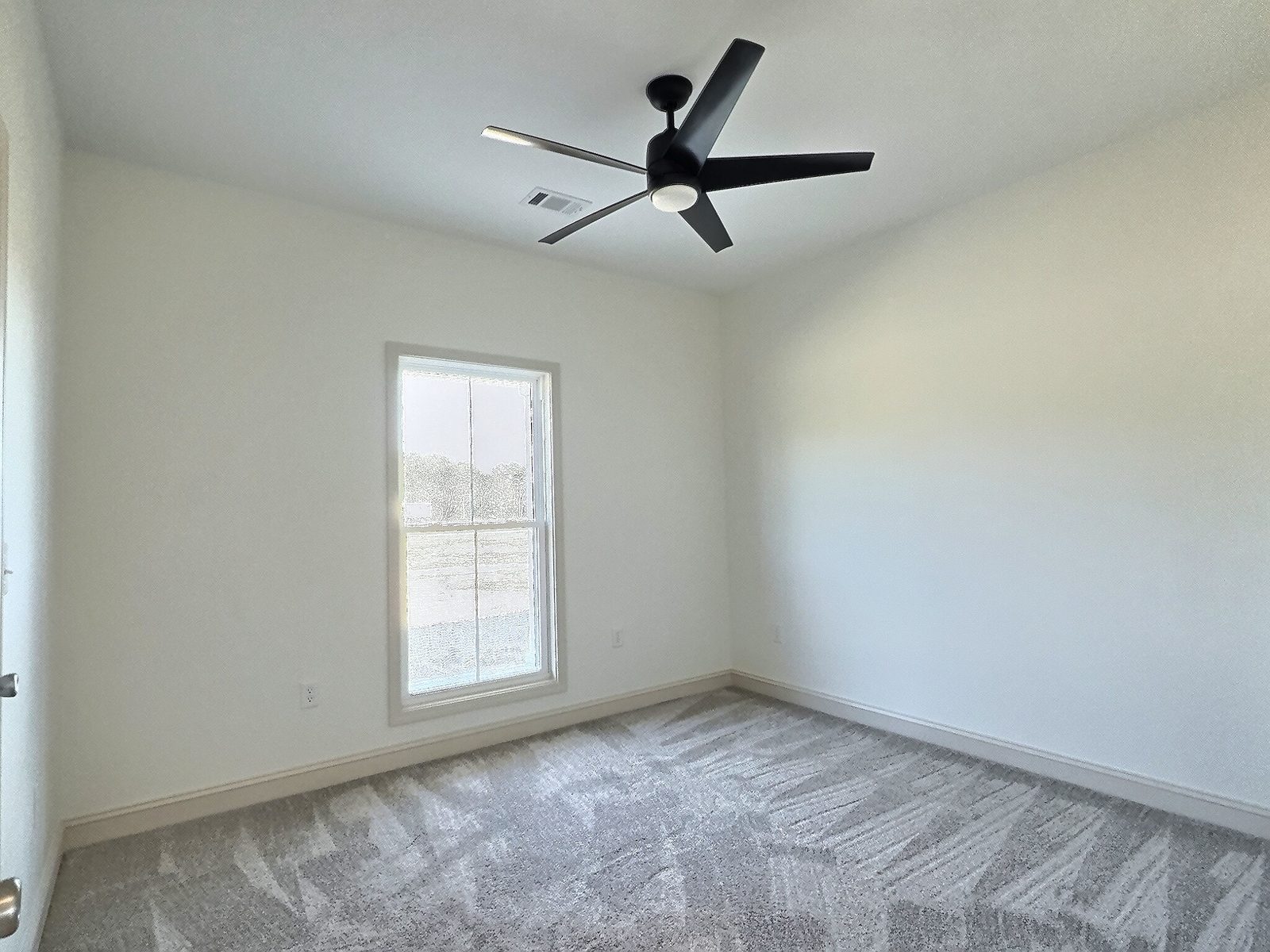 The White Farmhouse carpeted bedroom with window