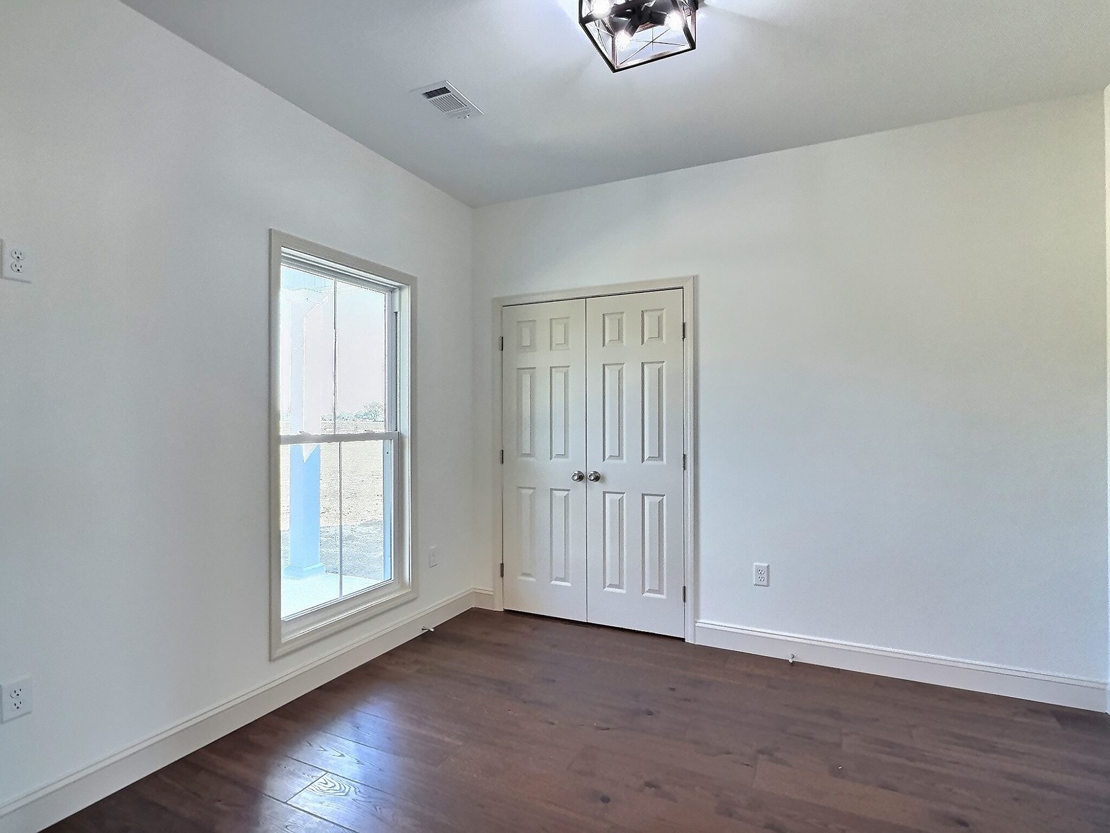 The White Farmhouse bedroom with double closet doors