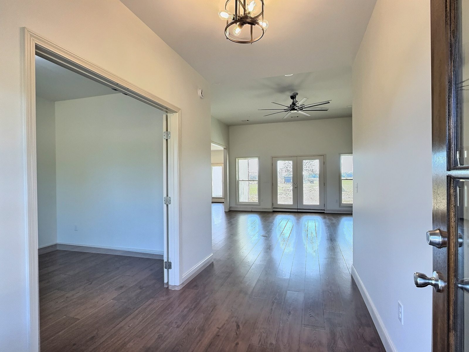 The White Farmhouse foyer looking into the living room