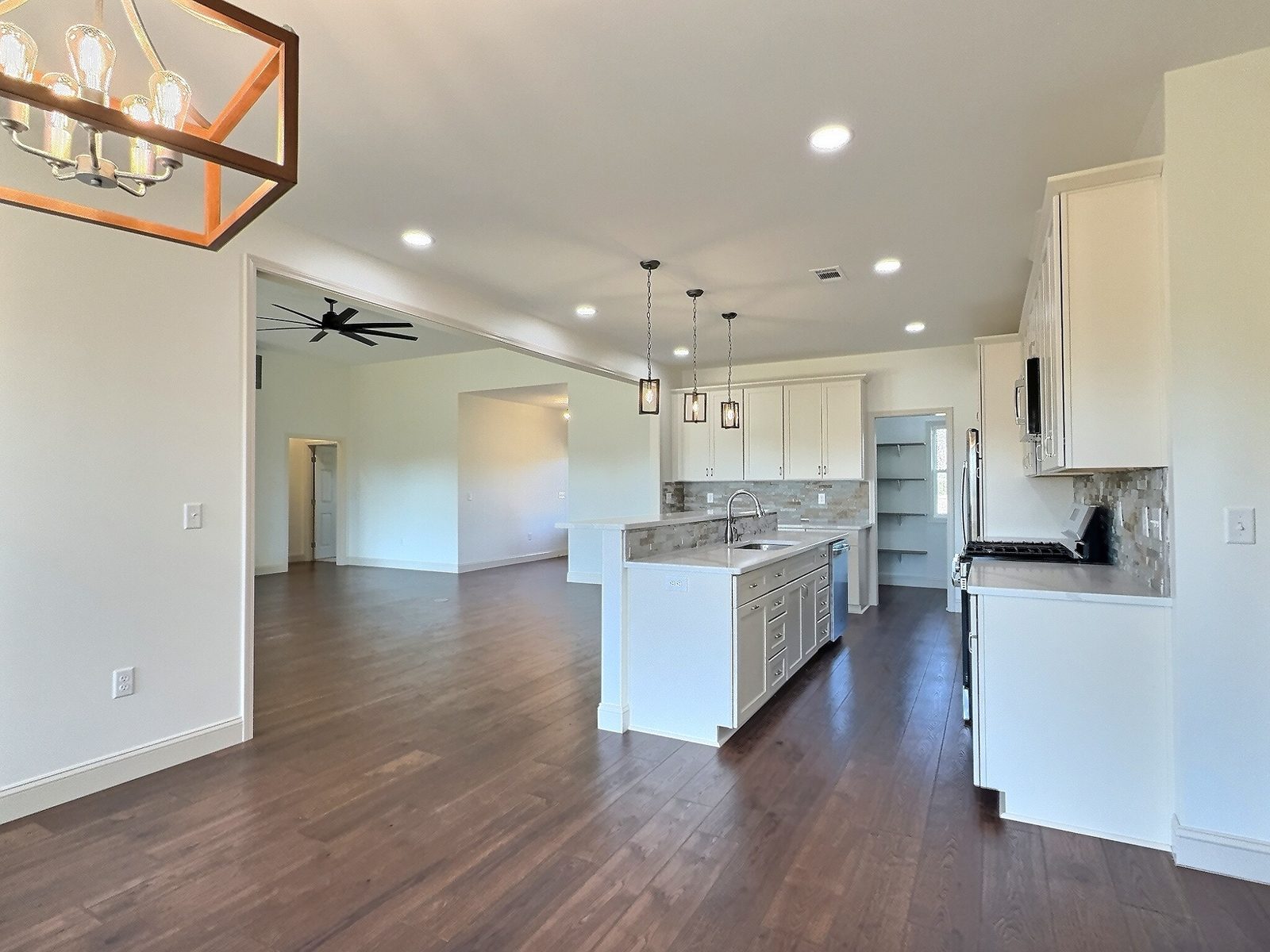 The White Farmhouse kitchen and dining area with lantern lights