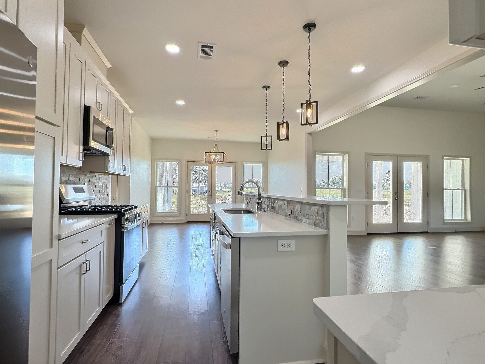 The White Farmhouse kitchen island looking toward the living room