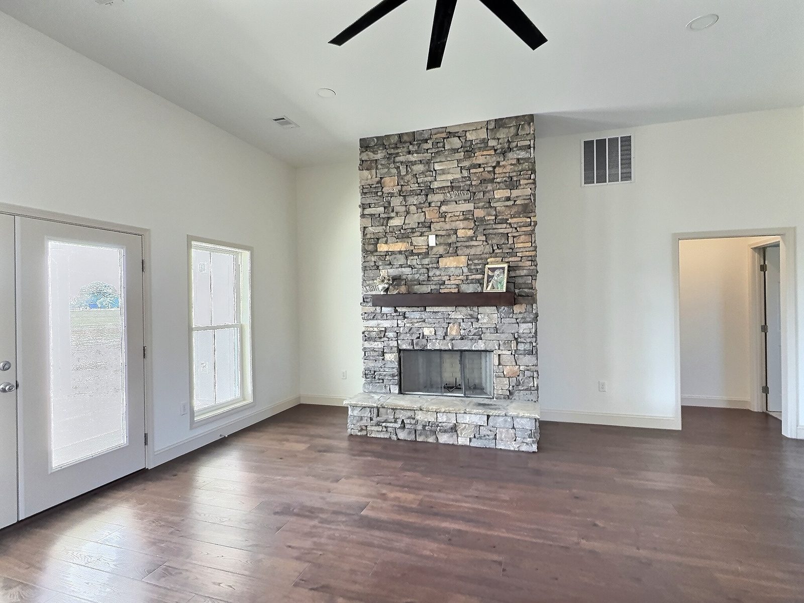 The White Farmhouse stacked stone fireplace close-up