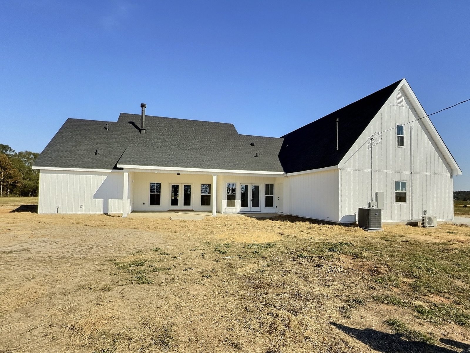 The White Farmhouse rear exterior with covered back porch